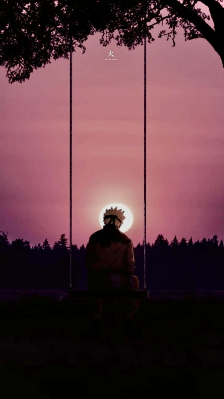 鳴人樹下夕陽鞦韆 壁紙 — 夕陽下鳴人坐在鞦韆上的剪影，背後發光的太陽被樹枝框住。