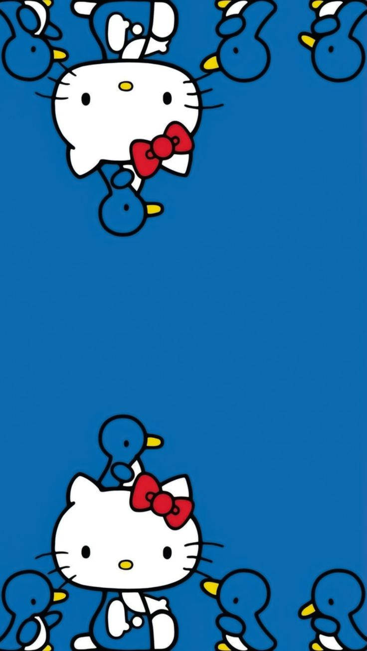 Hello Kitty 身穿藍色西裝配紅色蝴蝶結，被小鴨圍繞。 — Hello kitty 美學 GIF 壁紙