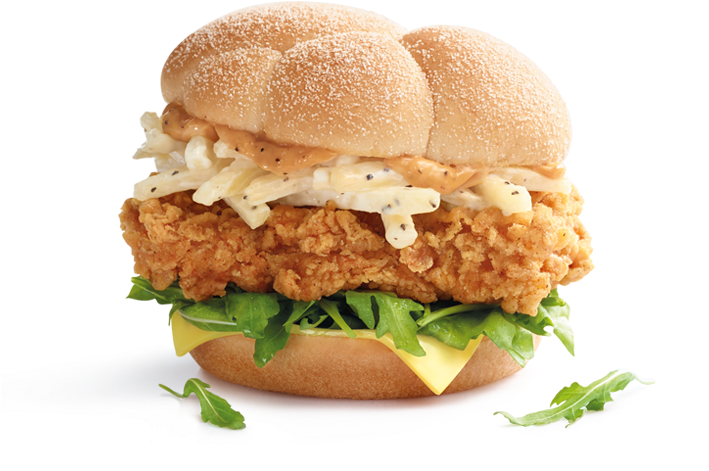 麥當勞酥脆雞肉三明治 壁紙 — 金黃酥脆炸雞三明治，配上奶油醬、芝麻菜和芝士，放在芝麻麵包上。