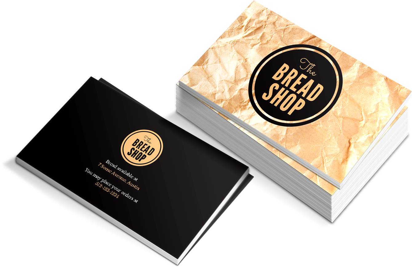 麵包店商務卡設計 壁紙 — 一堆皺紋金色名片，用於 The Bread Shop，黑色背面和金色標誌，黑色背景。