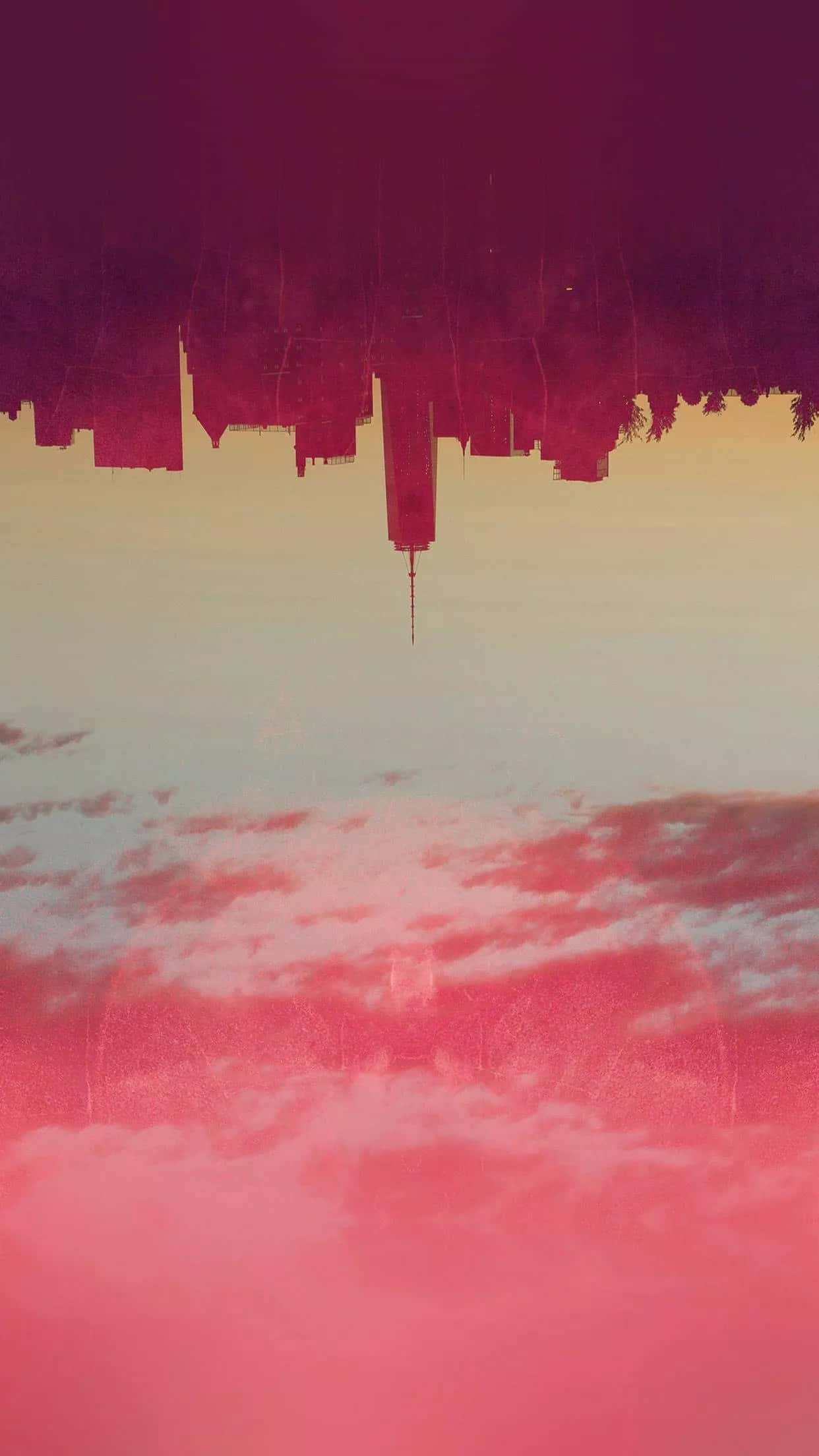 Vintage Aesthetic 桌布 壁紙 — 黃昏時分，粉紅色和紫色雲彩的天空中倒映出超現實的倒置城市景觀。