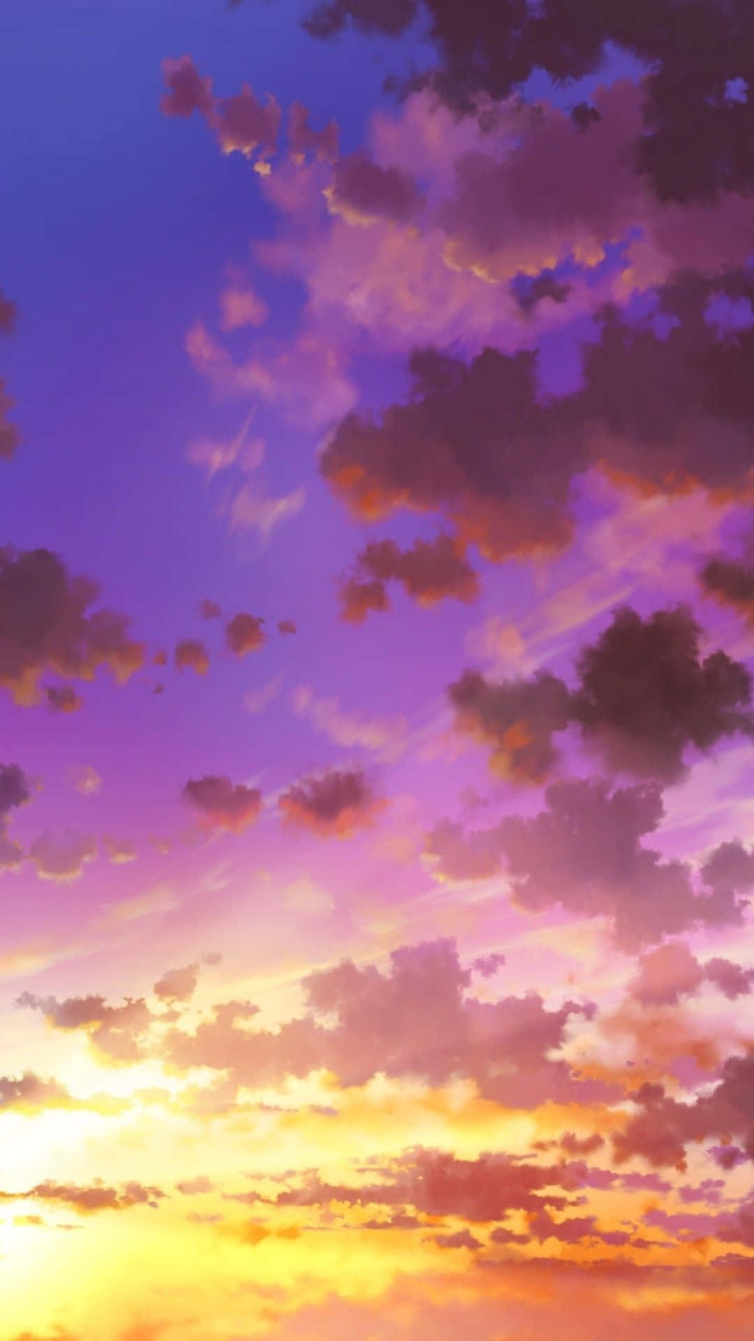 在暮色天空中閃耀的紫色、粉紅色和橙色雲彩。