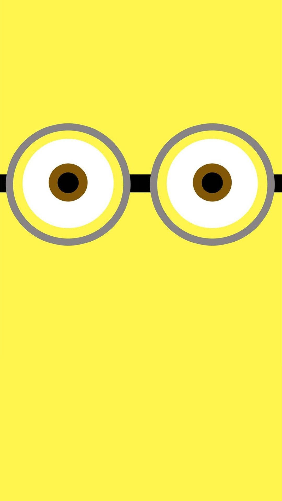 簡約 桌布 壁紙 — 黃色Minion的大眼睛特寫，戴著黑色護目鏡，背景為純黃色。