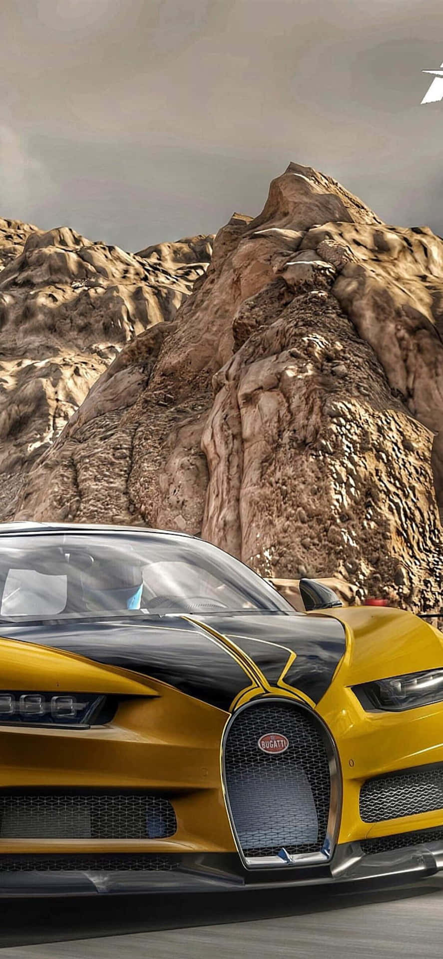 黃黑相間的Bugatti在日落時分疾馳穿過沙漠峽谷。 — 布加迪 壁紙