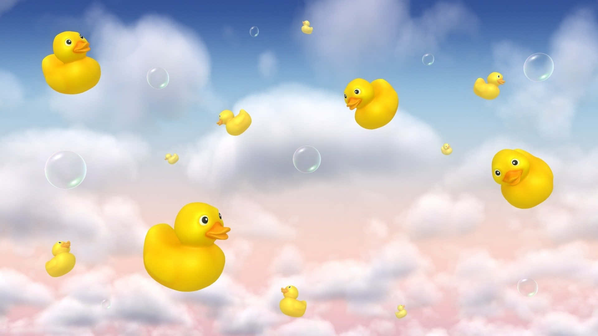 Cute Duck 桌布 壁紙 — 黃色橡膠鴨子在柔和的藍色和粉紅色天空背景下，在蓬鬆的雲朵和肥皂泡之間異想天開地漂浮。