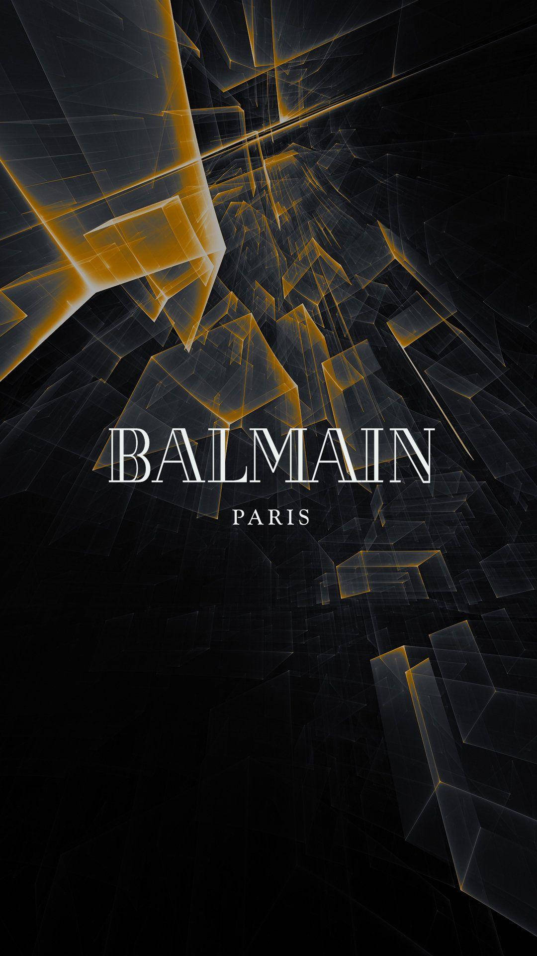 黑色背景上帶有 Balmain Paris 文字的抽象金色幾何形狀