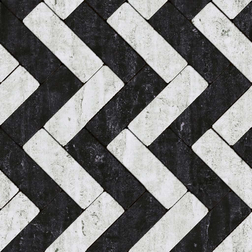 Black And White Texture 桌布 壁紙 — 黑白大理石瓷磚的特寫，以大膽的人字形圖案排列，帶有天然紋理。