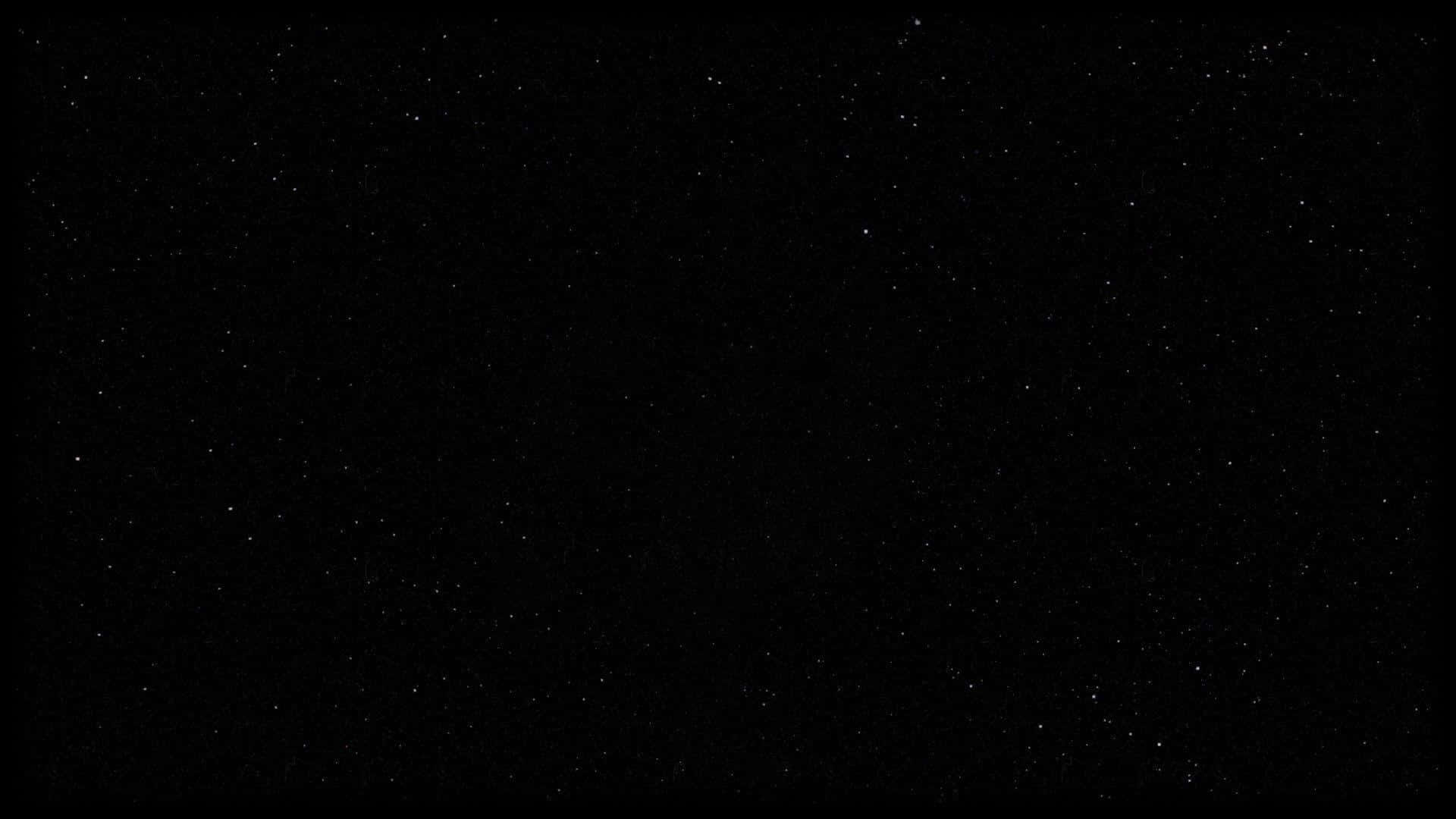 在黑色虛空背景下，佈滿無數遙遠星星的星空夜空。