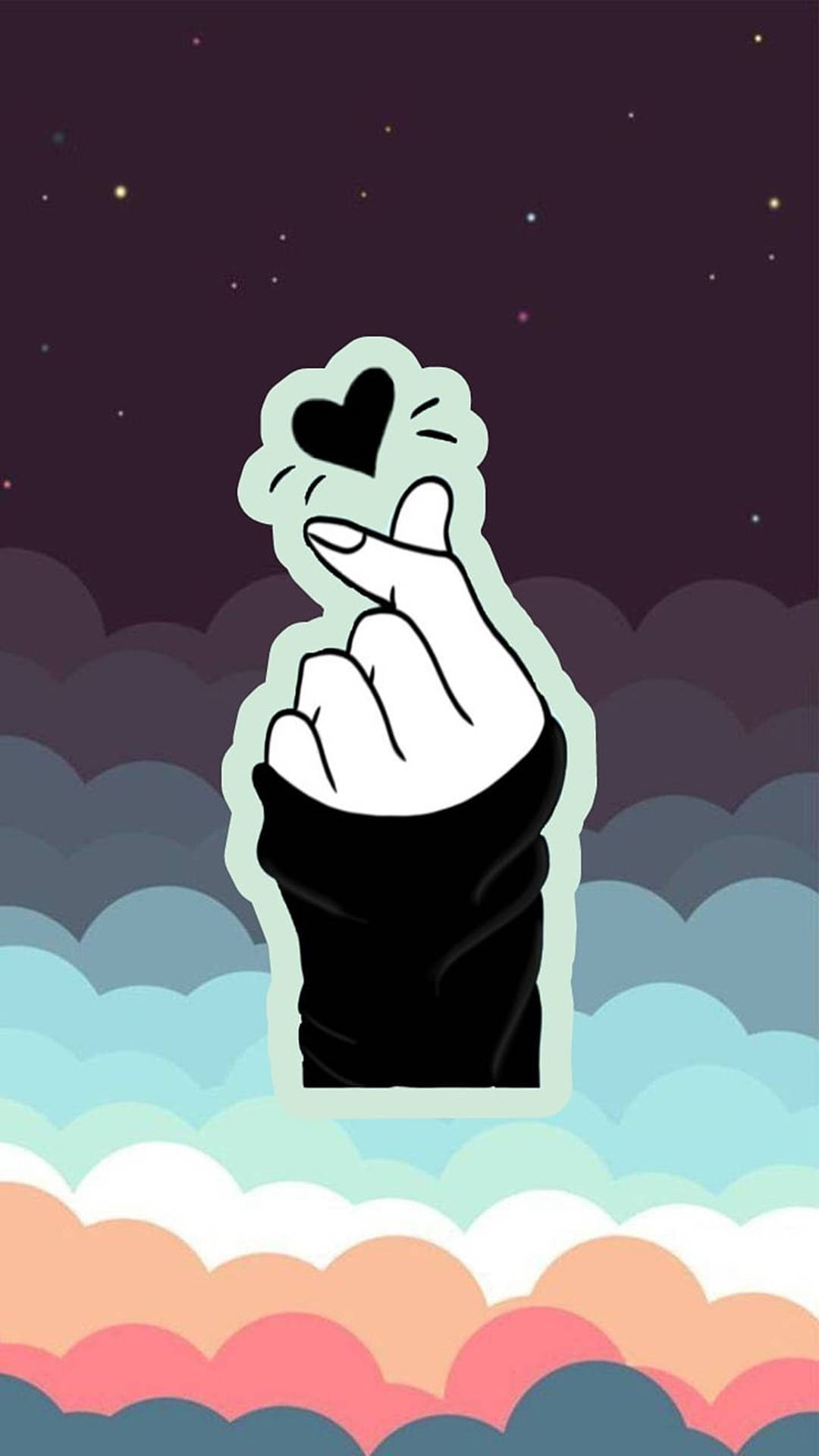 手在星空和彩色雲朵前形成心形。