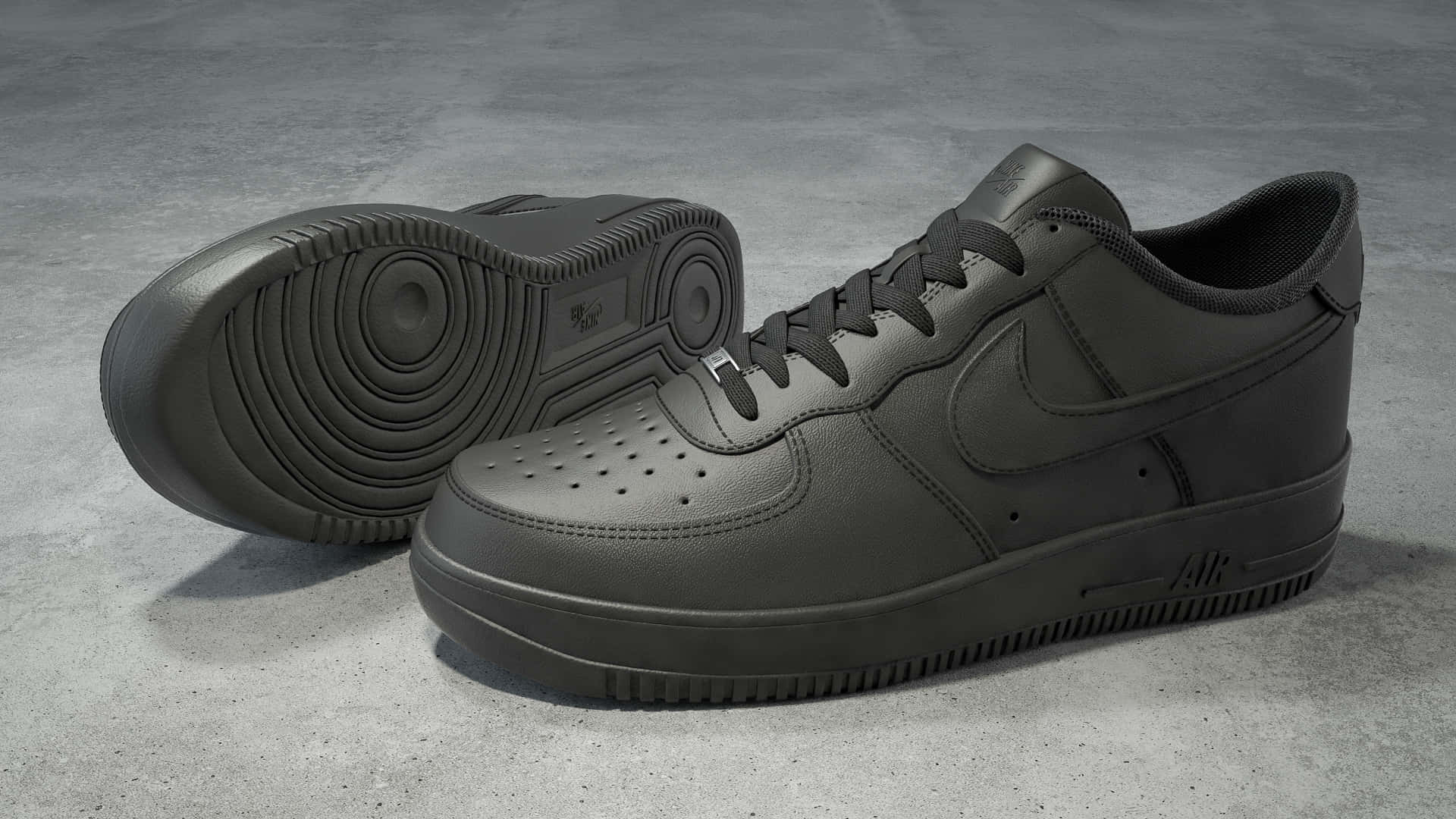 灰色混凝土地板上的兩對黑色Nike Air Force 1運動鞋。