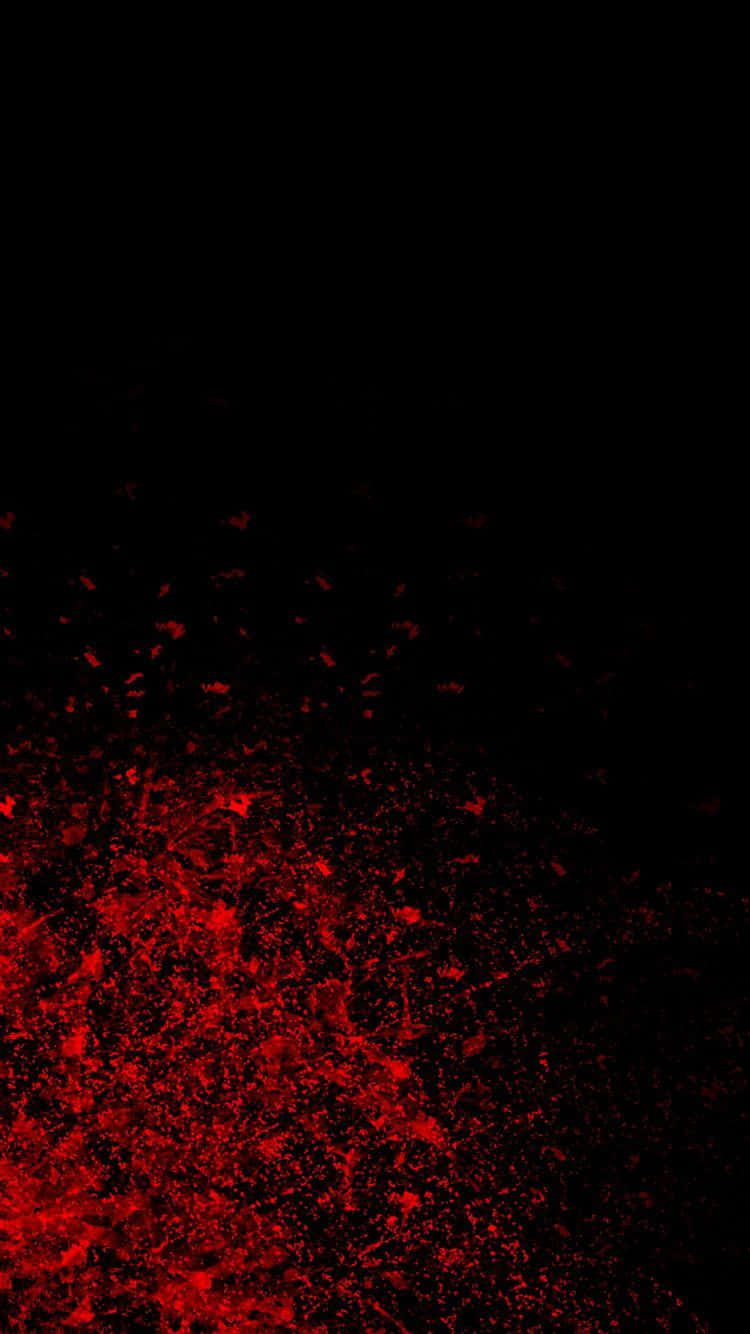 黑紅iPhone，無限可能 壁紙 — 充滿活力的紅色粒子在深黑色背景上爆炸，形成動態的抽象爆發。