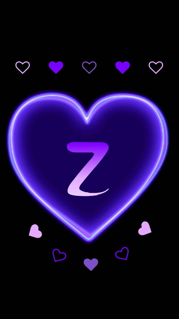 黑紫風格字母 Z 壁紙 — 一個發光的紫色霓虹心形，內有風格化的 Z，周圍環繞著較小的心形，背景為黑色。