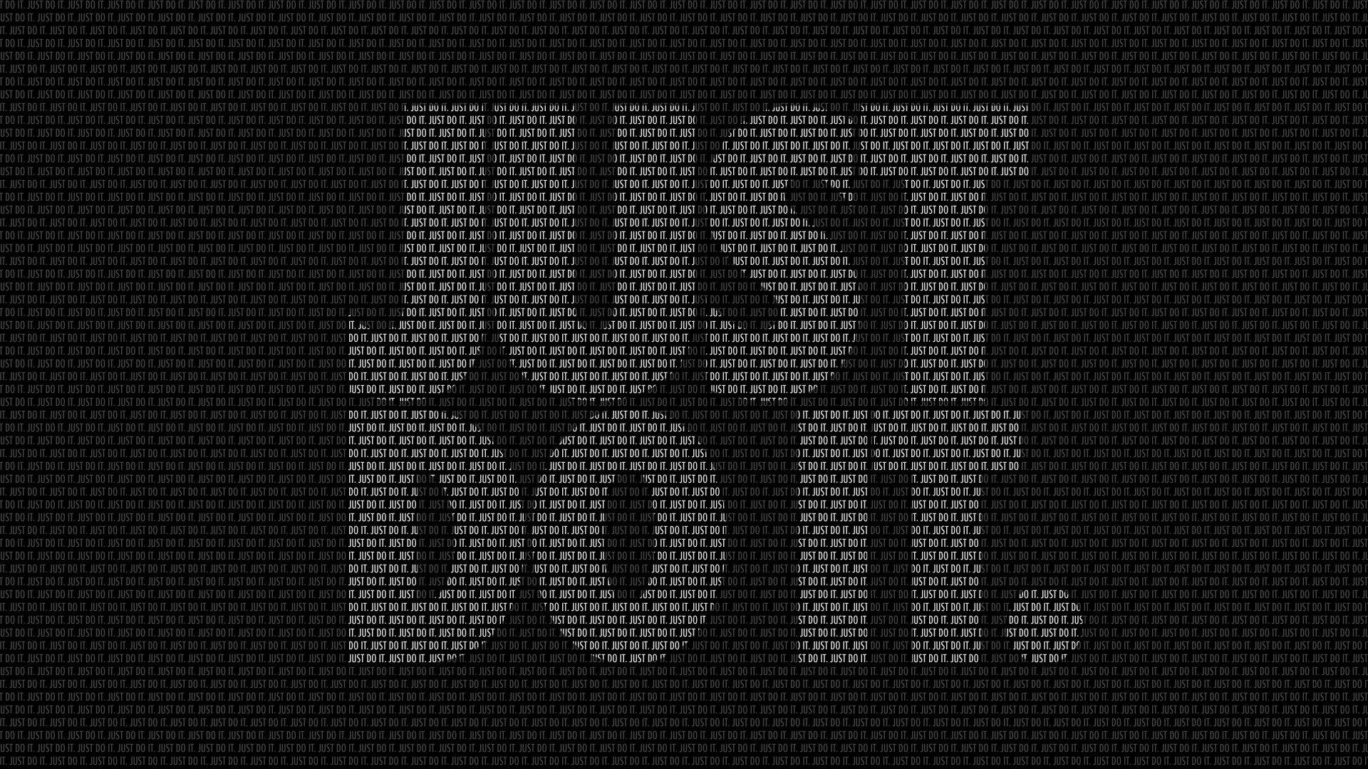 黑色「Just Do It」圖案 壁紙 — 白色重複二進制代碼在黑色背景上形成密集場域，創造出高科技數位數據流壁紙。