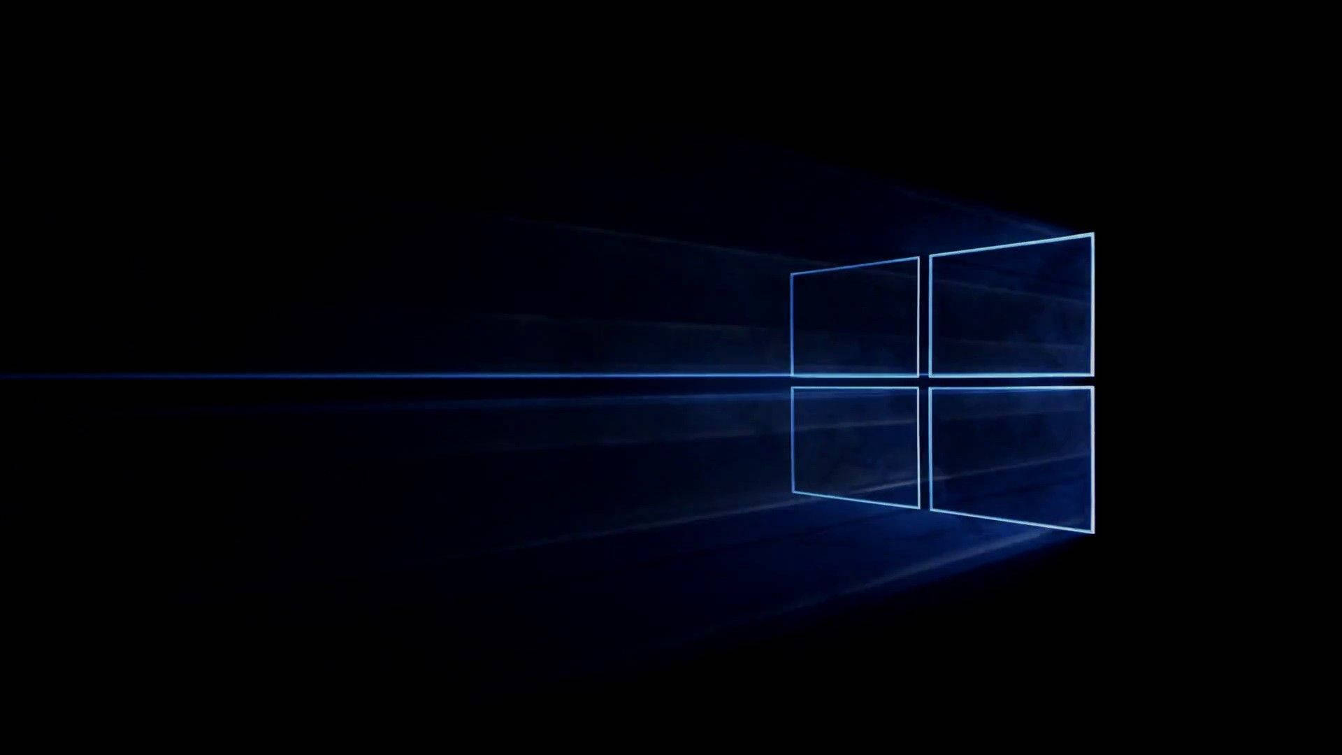 發光的藍色Windows標誌，帶有光線，黑色背景。