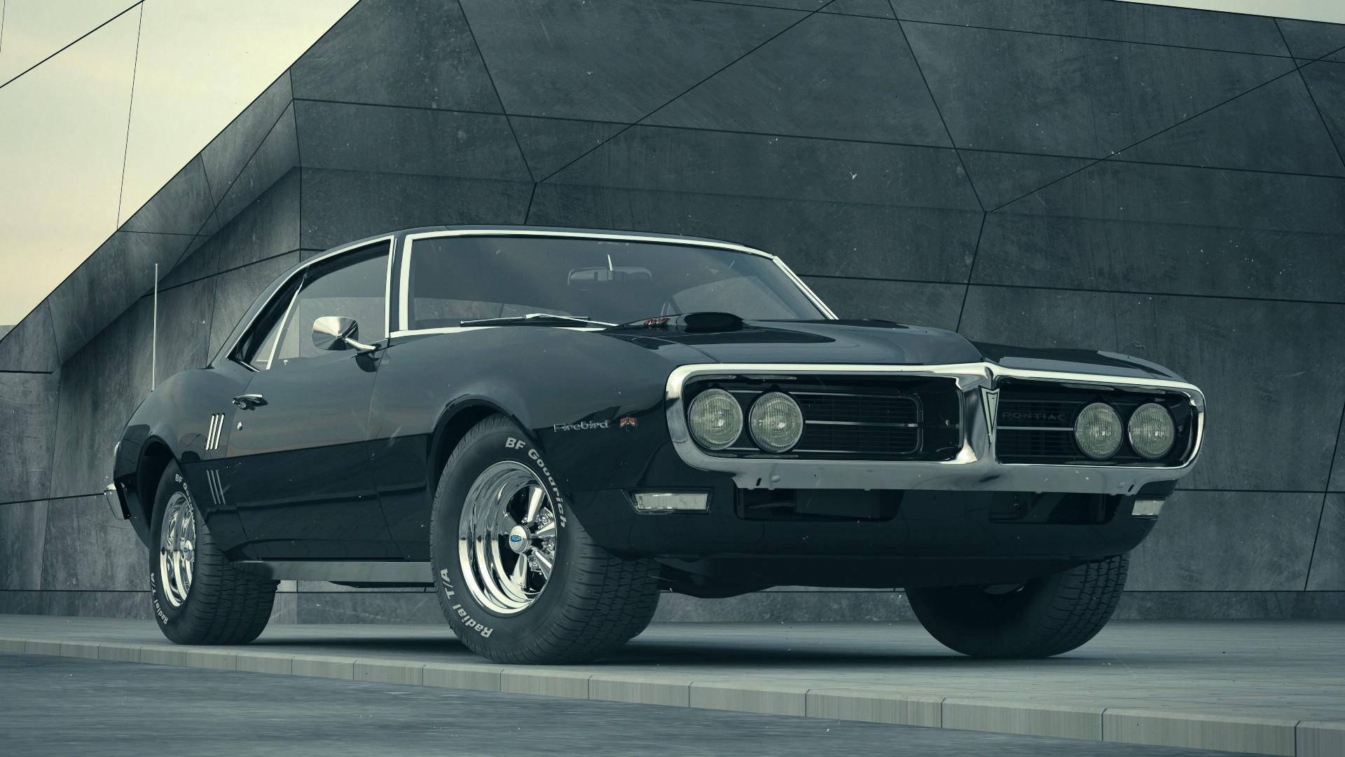 黑色2002款龐蒂克火鳥賽車 壁紙 — 一輛時尚的黑色經典肌肉車，帶有鍍鉻裝飾，停放在現代幾何混凝土牆前。