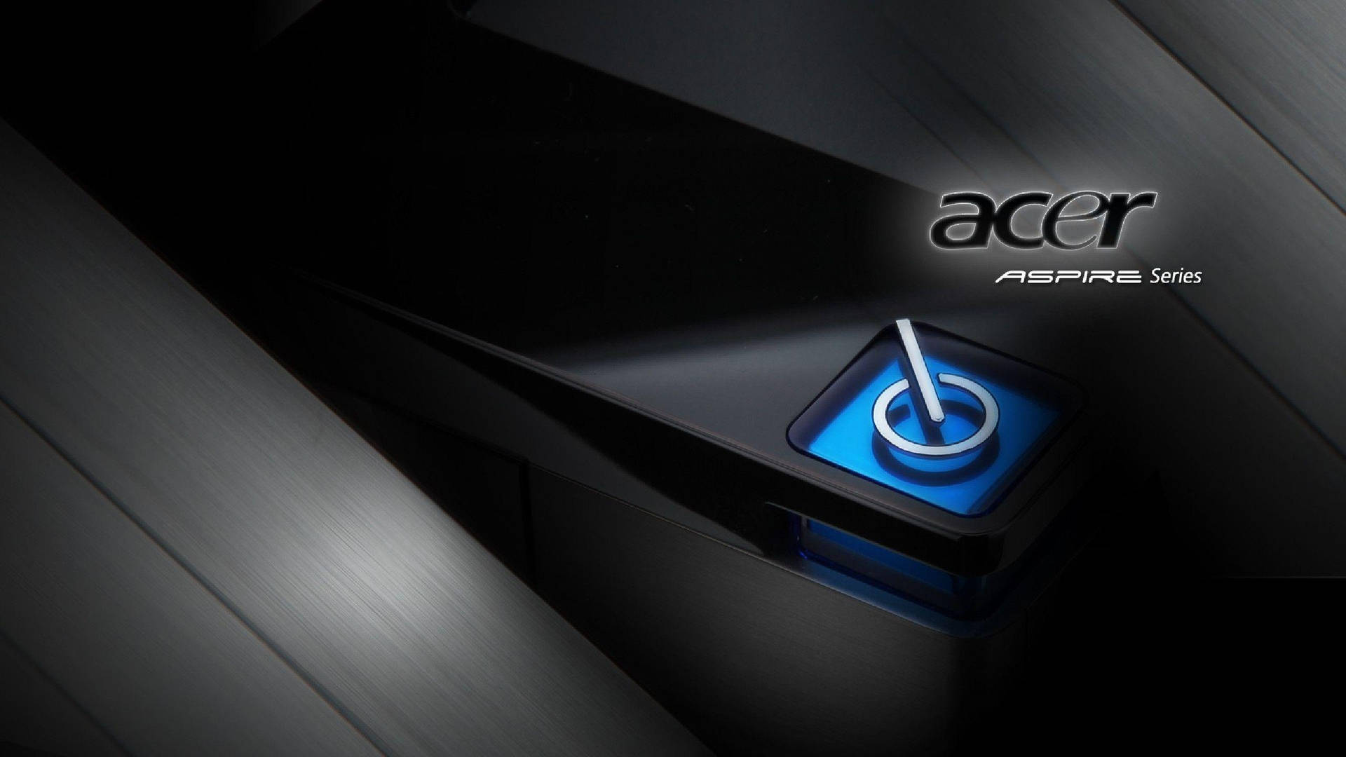黑色Acer Aspire手提電腦特寫，帶有發光的藍色電源按鈕。