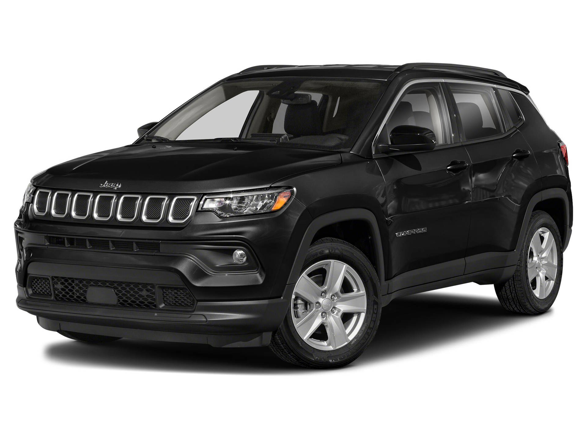 黑色Jeep Compass SUV，帶有鍍鉻格柵和銀色輪圈，背景為白色。