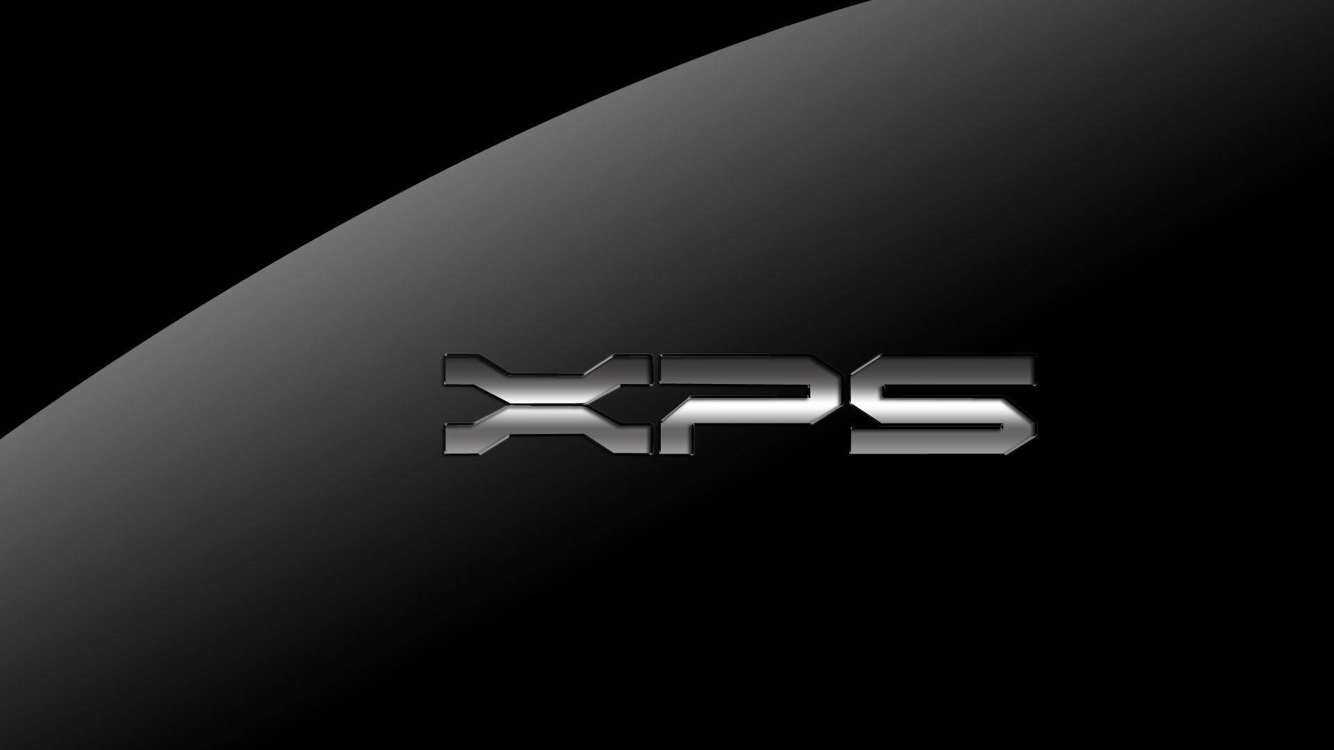 黑色XPS Dell HD 壁紙 — 閃亮鍍鉻XPS標誌居中於時尚黑色弧形表面，搭配漸變燈光。