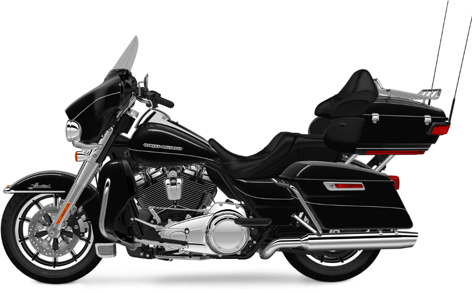 黑色哈雷戴維森巡遊摩托車 壁紙 — 一架時尚黑色Harley-Davidson旅行電單車，帶有鍍鉻裝飾和側袋，孤立在純黑色背景上。