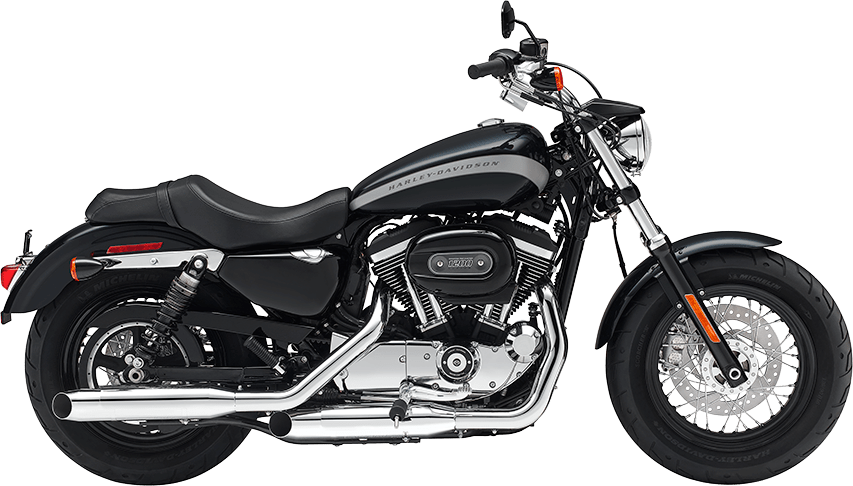 黑色哈雷戴維森機車側面圖 壁紙 — 一架時尚黑色Harley-Davidson電單車，帶有鍍鉻裝飾和銀色排氣管，立在純綠色背景前。