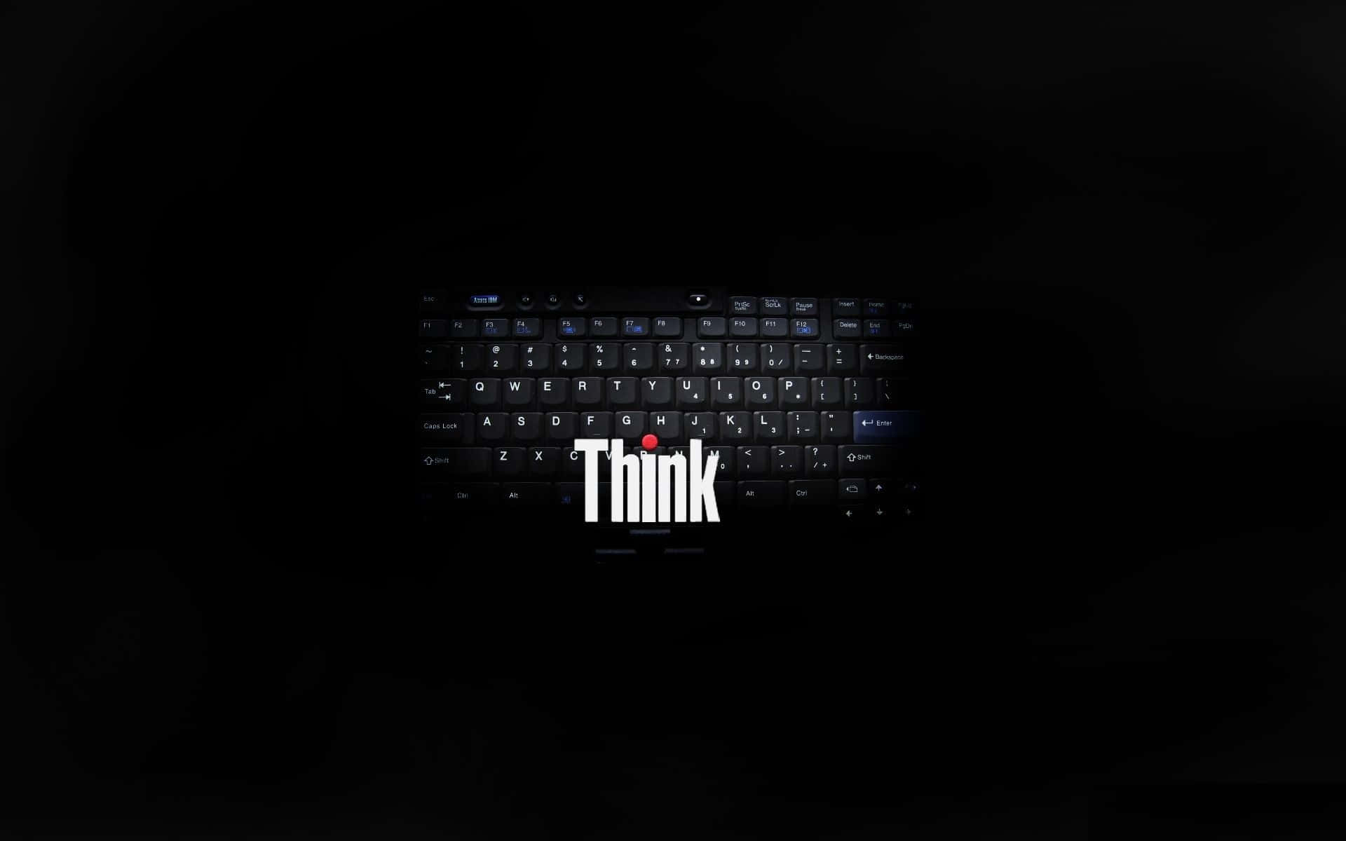 Lenovo 桌布 壁紙 — 黑色手提電腦鍵盤置於黑暗中，帶有發光白色「Think」標誌及空格鍵下方的紅點。
