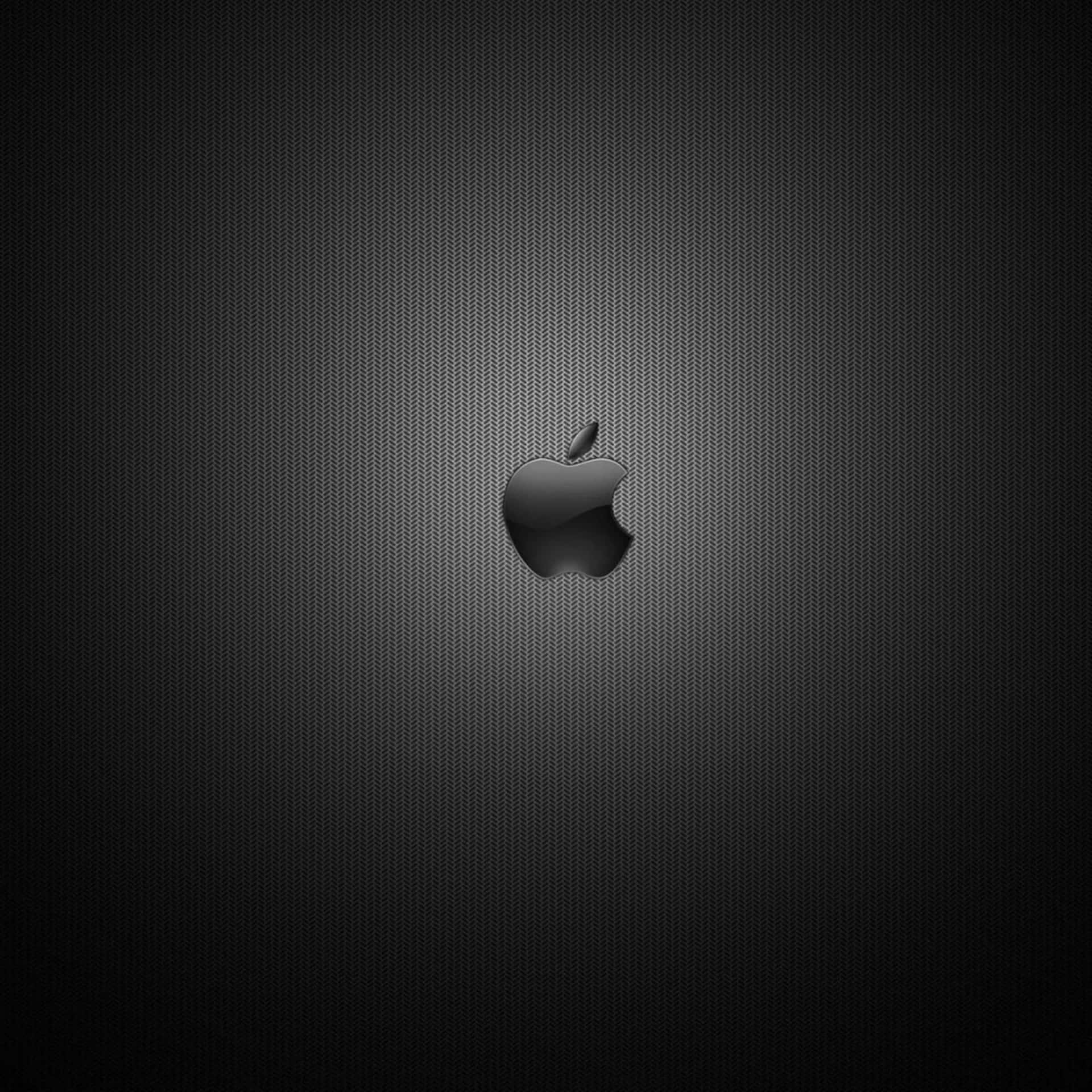 黑色Apple標誌在深色紋理背景上，帶有漸變照明。