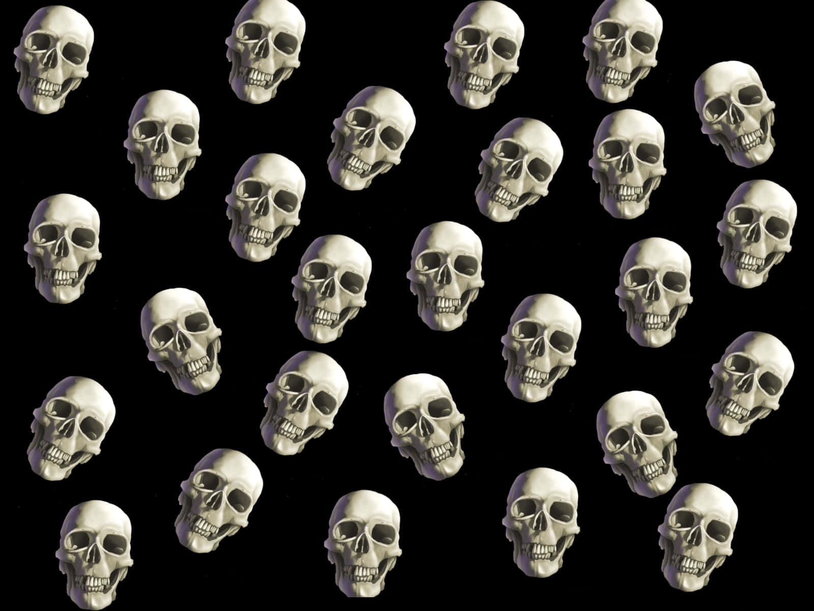 Halloween Skeleton 桌布 壁紙 — 黑色背景上，白色骷髏頭帶有空洞眼窩和牙齒的網格。