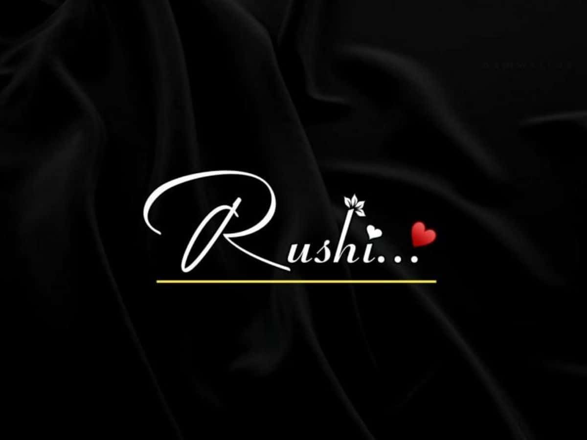 黑色背景上寫有「rushi」一詞 壁紙