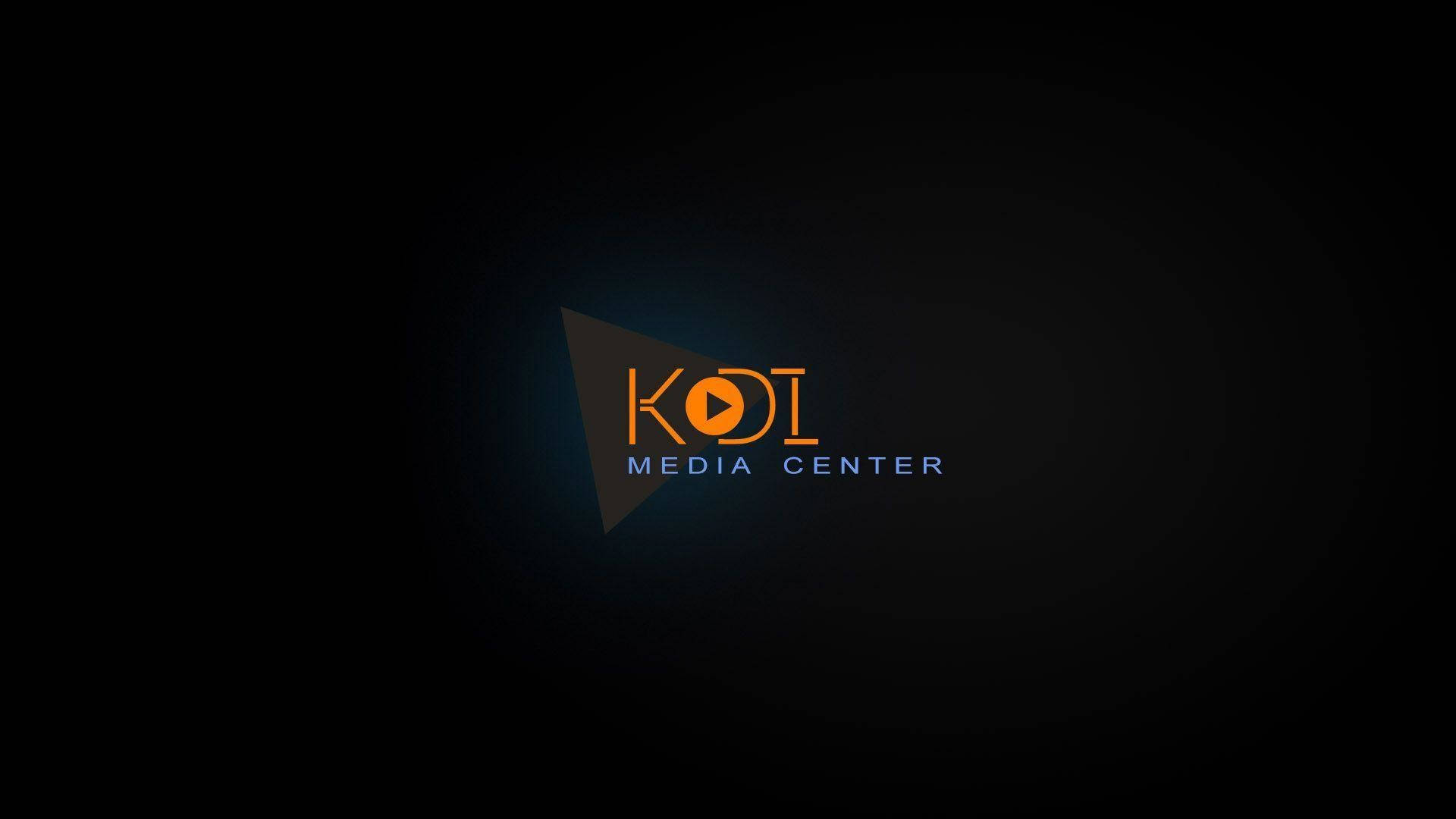 KOI Media Center 標誌，在深色背景上帶有橙色和藍色文字。