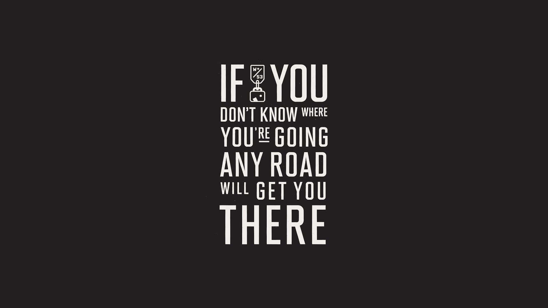 Minimalist Quote 桌布 壁紙 — 黑色背景上粗體白色文字寫著「IF YOU DON'T KNOW WHERE YOU'RE GOING ANY ROAD WILL GET YOU THERE」，其中「YOU」的「O」被行李箱圖標取代。