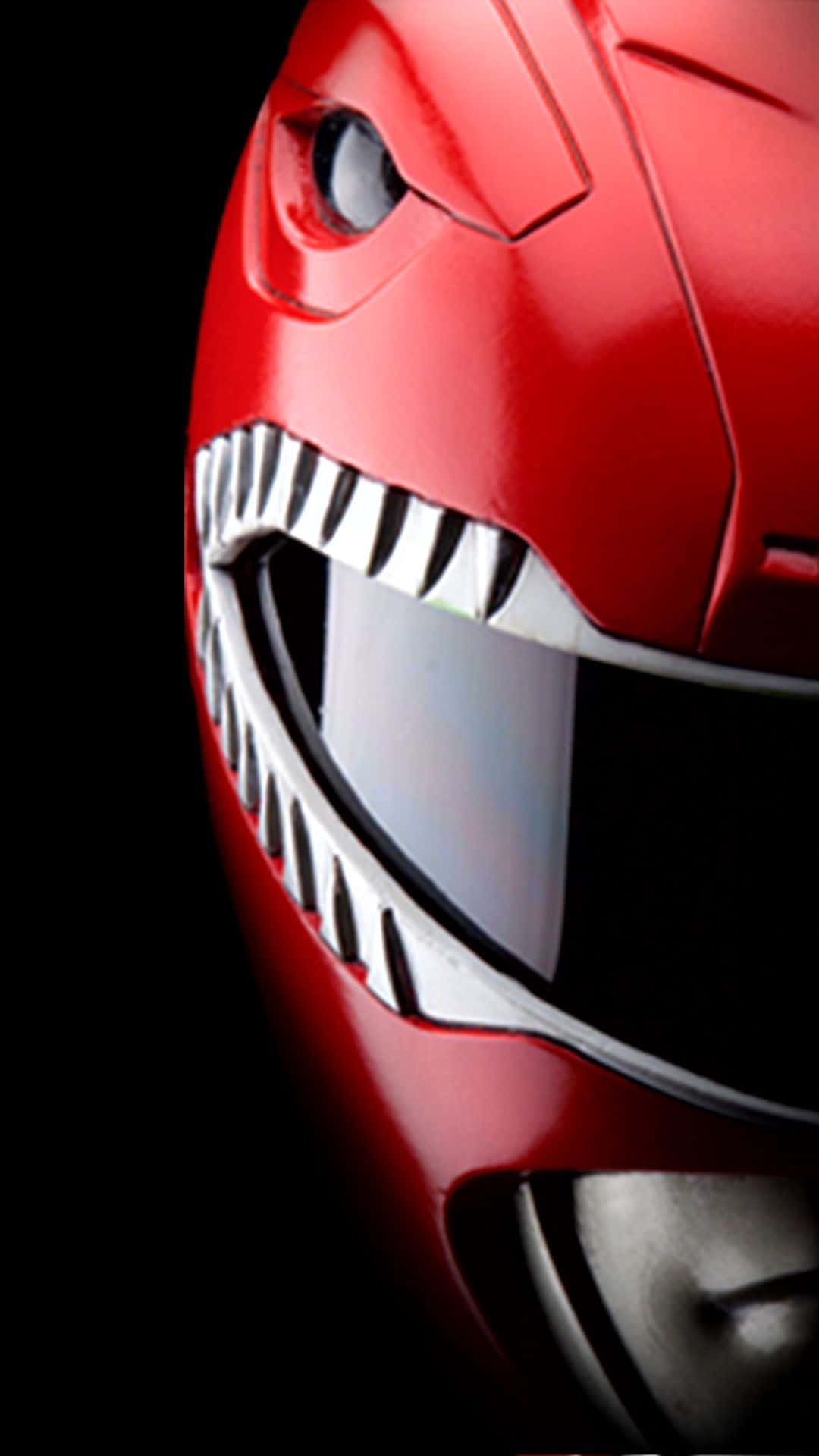 Power Rangers 桌布 壁紙 — 黑色背景上紅色Power Ranger頭盔的特寫，帶有鋒利的白色牙齒和發光的眼睛。
