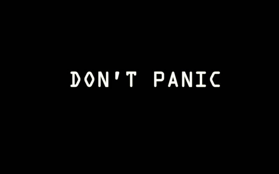 黑色背景別慌 壁紙 — 粗體白色文字寫著「DON'T PANIC」，居中顯示在純黑色背景上。