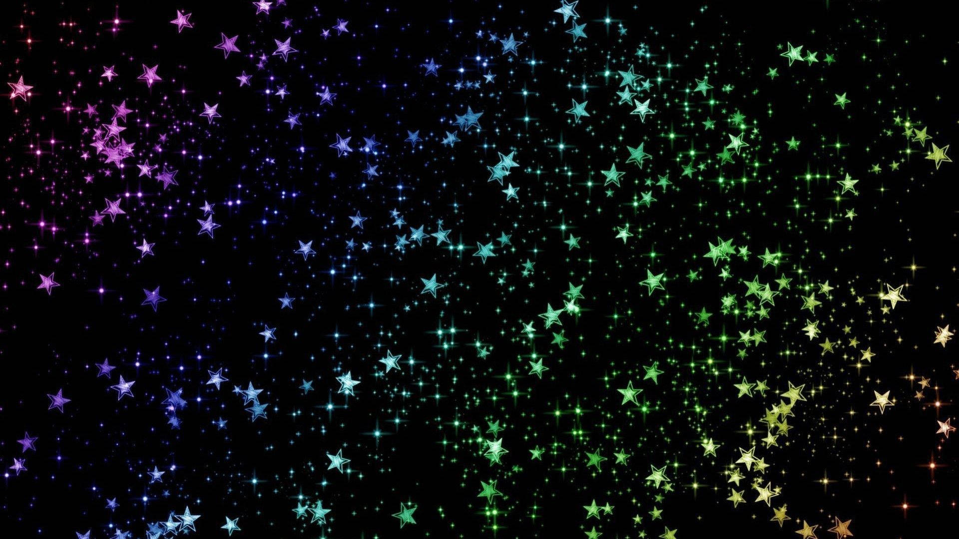 在黑色背景上，閃爍著多色光芒的星星如瀑布般傾瀉。
