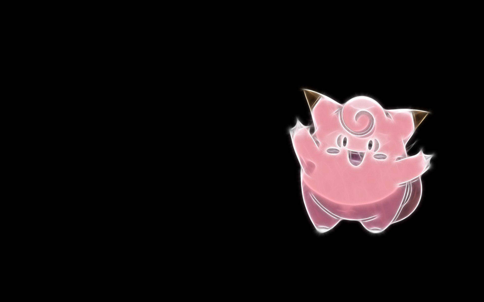 黑色背景的Clefairy 壁紙 — 發光的粉紅色 Jigglypuff 帶著愉快表情漂浮在純黑色背景上。