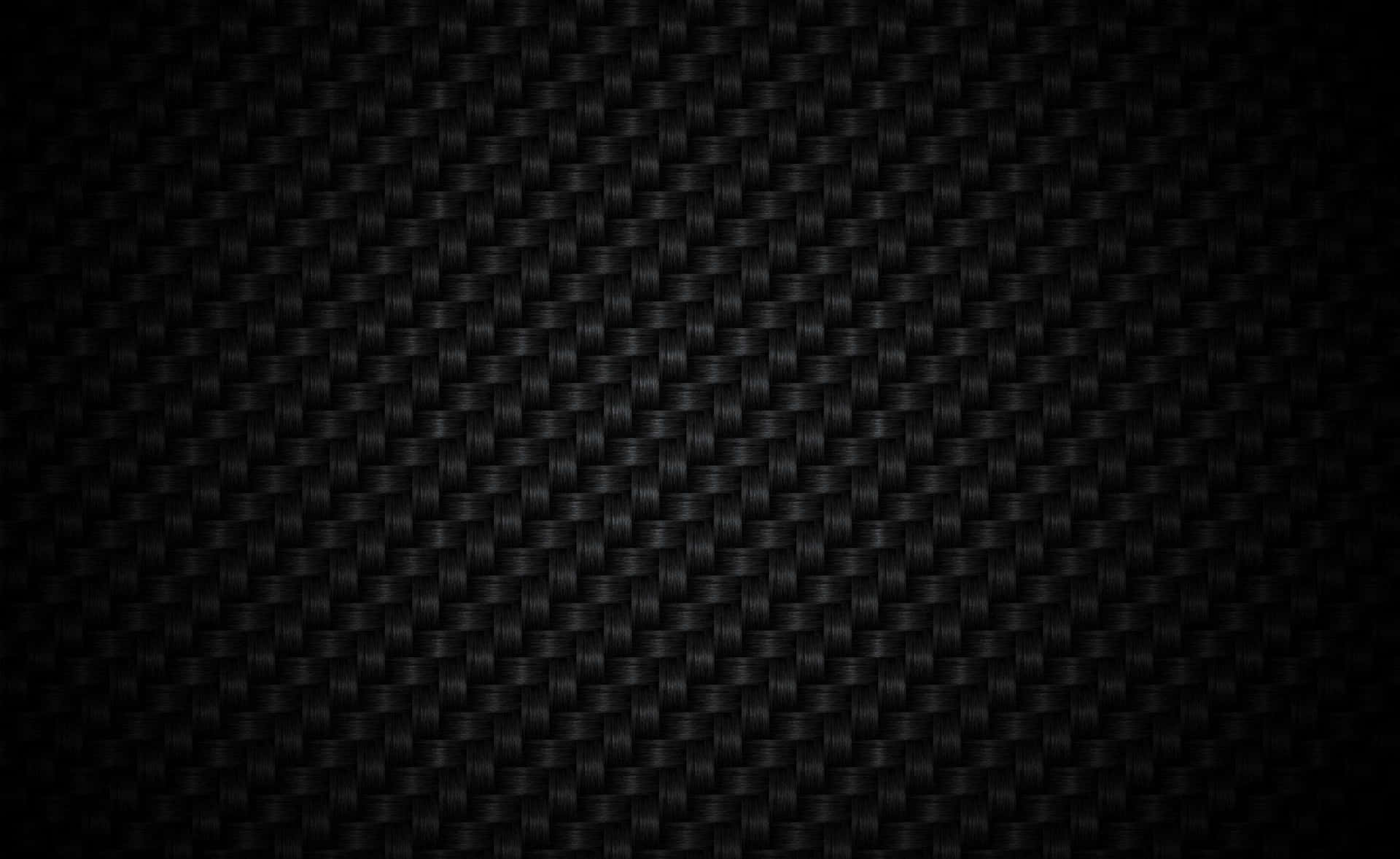 光滑黑色碳纖維紋理，帶有編織圖案和漸變燈光。