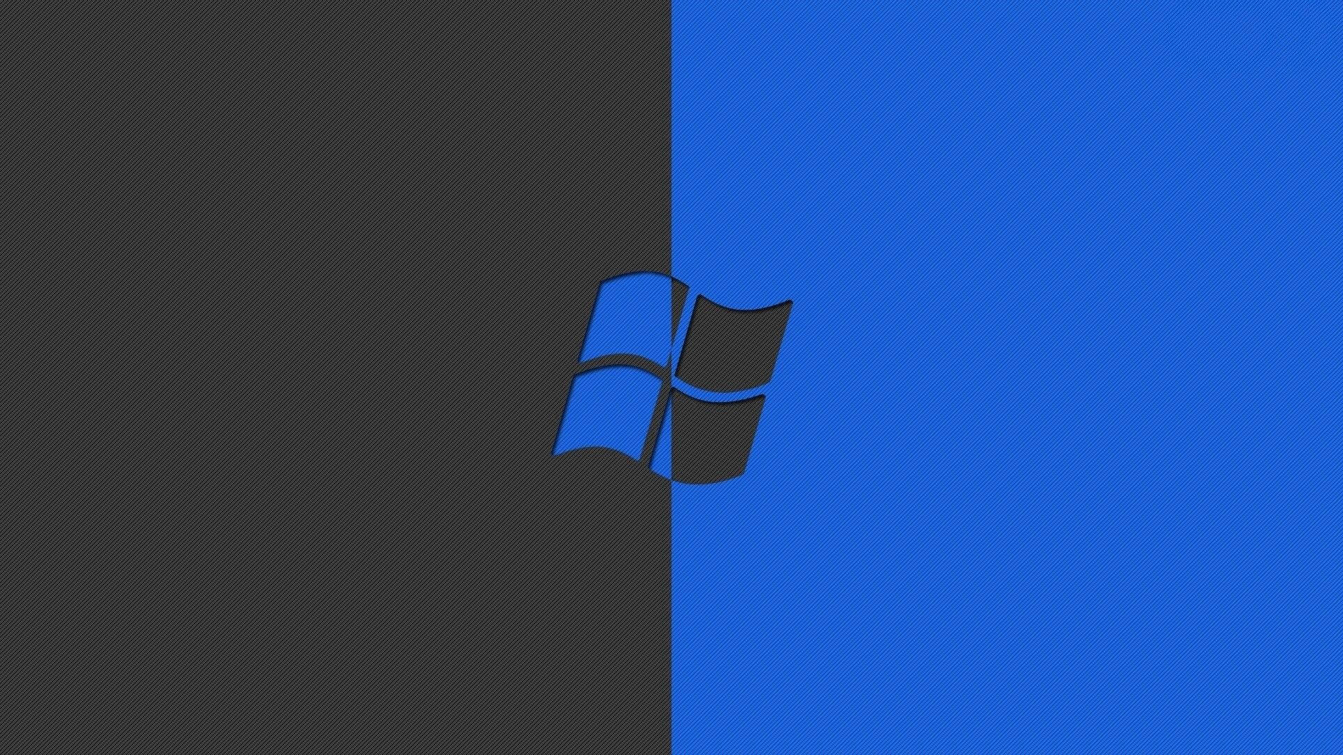 Windows 標誌在黑色和藍色分割背景上