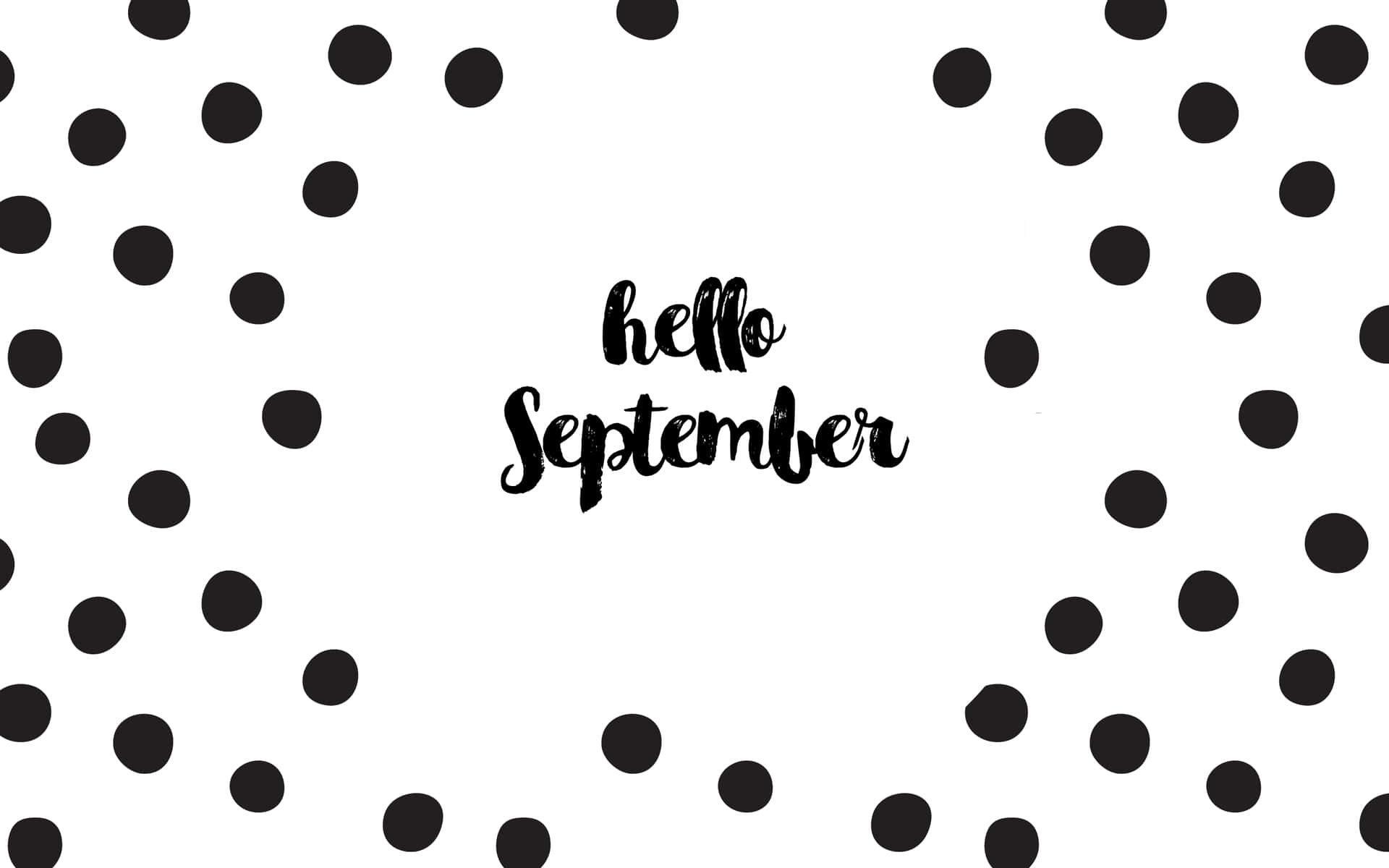黑色圓點圍繞著白色背景上手寫的文字「hello September」。