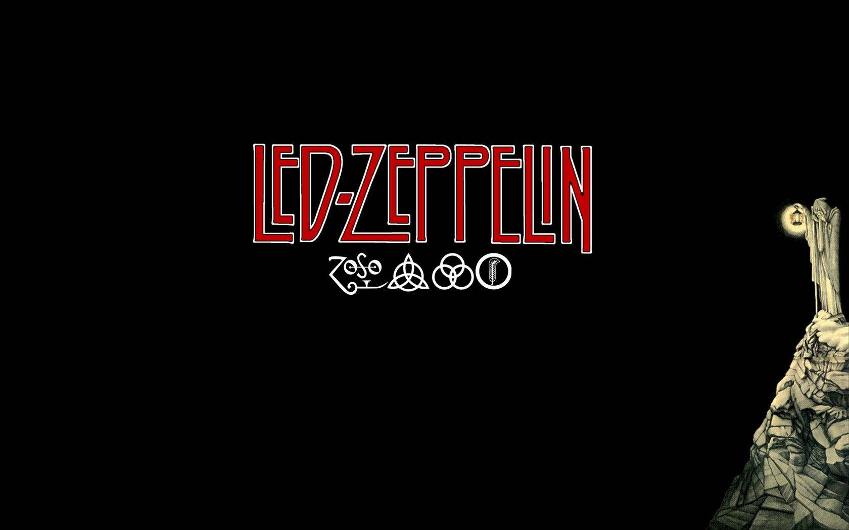 Led Zeppelin 標誌與手持發光球體的石像，黑色背景