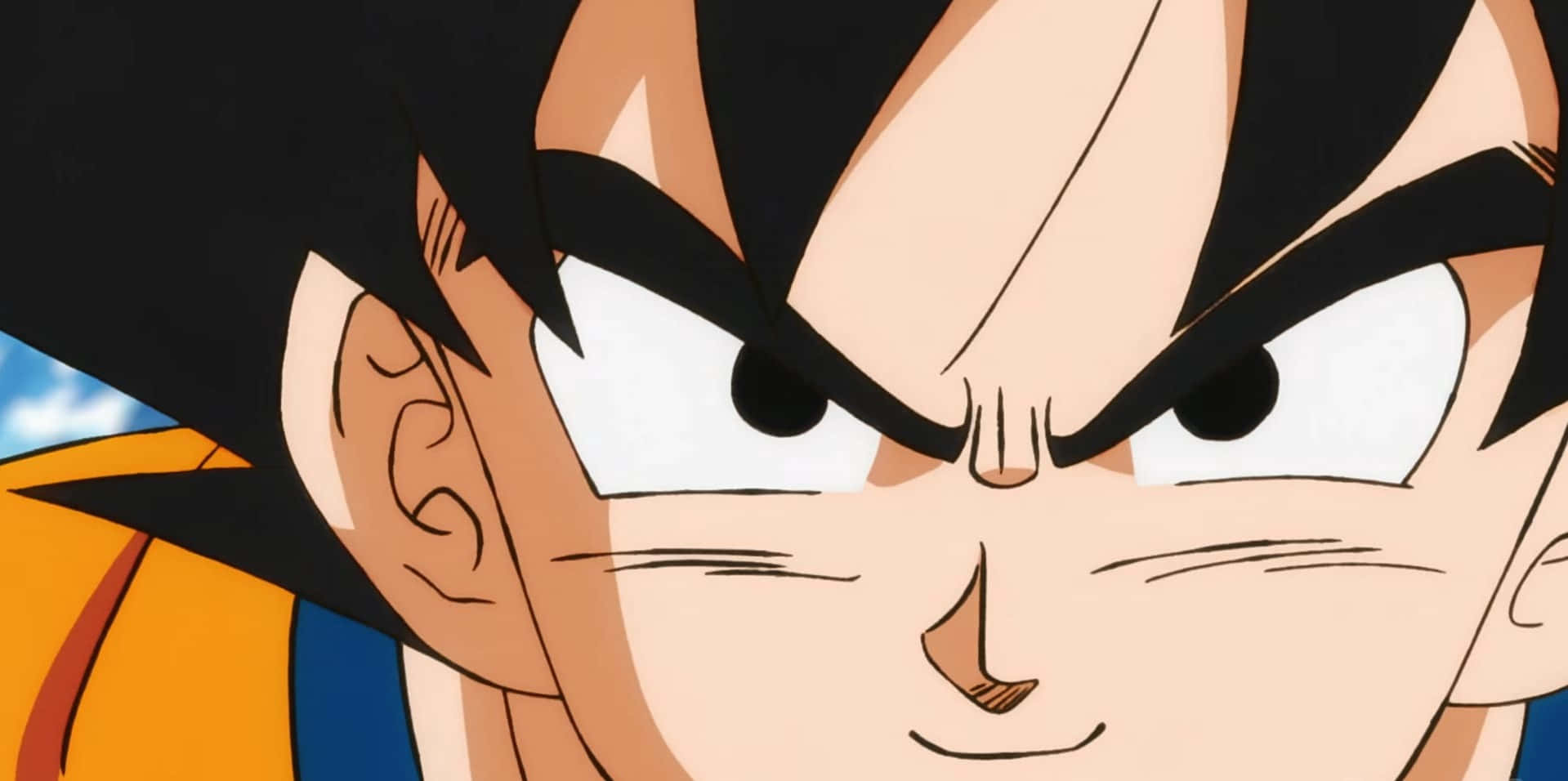 Dragon Ball Movies 桌布 壁紙 — 龍珠中悟空的近距離特寫，眼神銳利、表情兇猛，背景為藍天。
