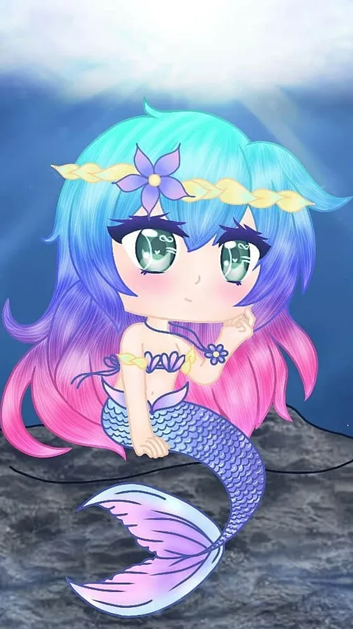 藍色和粉色頭髮的Q版美人魚坐在水下,戴著花冠。