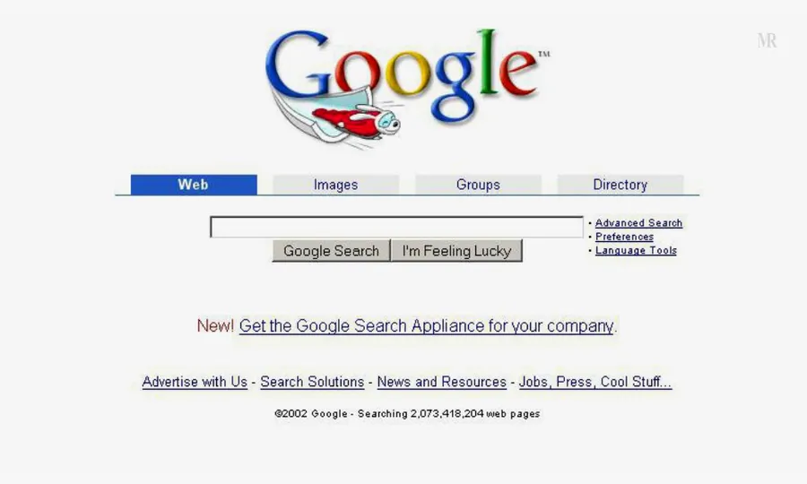 2002 年 Google 搜索引擎首頁,帶有火箭標誌和搜索欄。