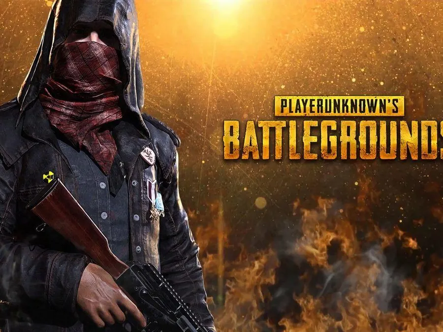 一名戴面具的士兵在熾熱的夕陽中手持步槍,帶有 PUBG 標誌。
