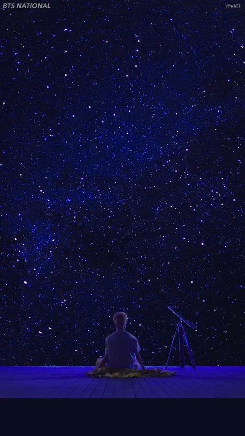 人坐在甲板上星空下與望遠鏡