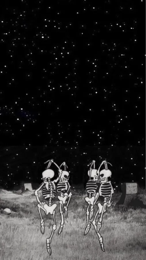 兩個骷髏在星空下的墓園裡跳舞。