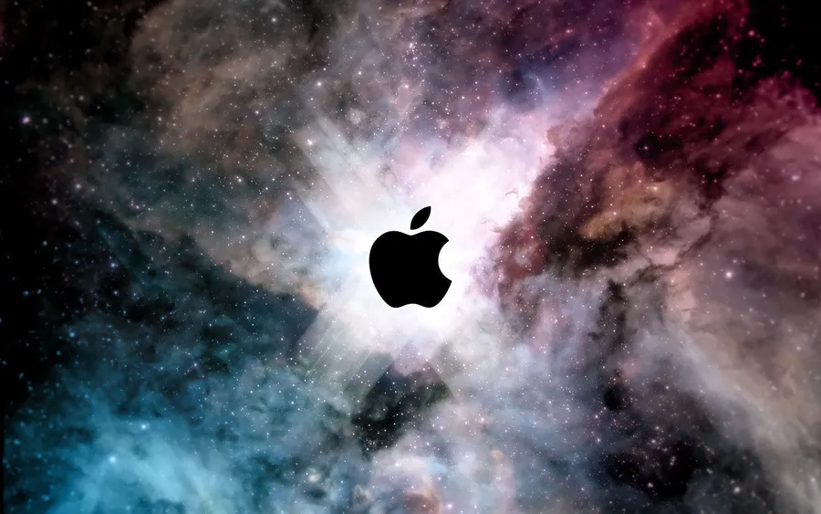 黑色Apple標誌漂浮在色彩繽紛的星空宇宙星雲中。