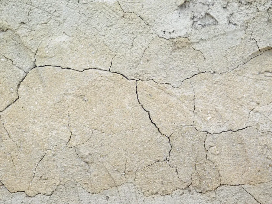 乾燥開裂的地表,帶有米色色調和粗糙紋理