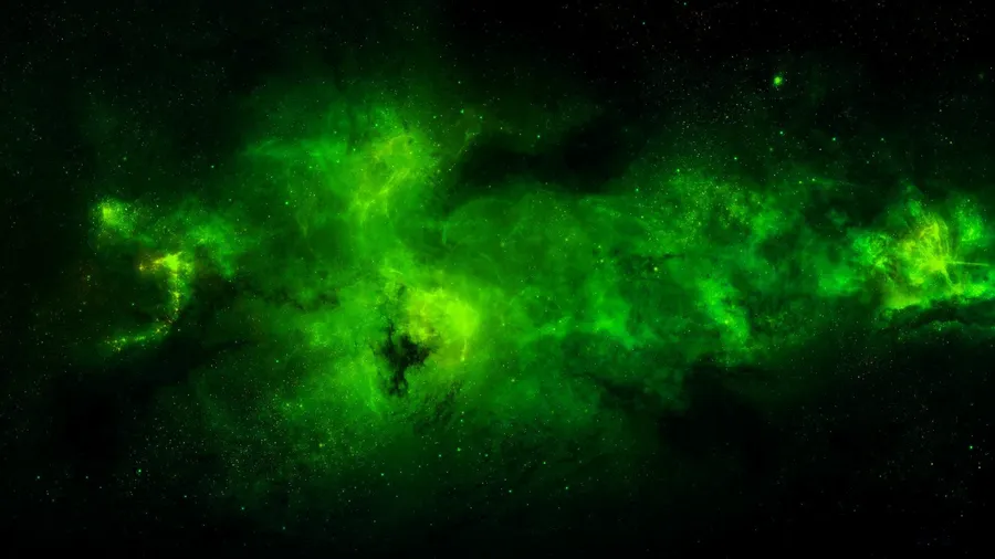 深空中散佈著星星的發光綠色星雲。