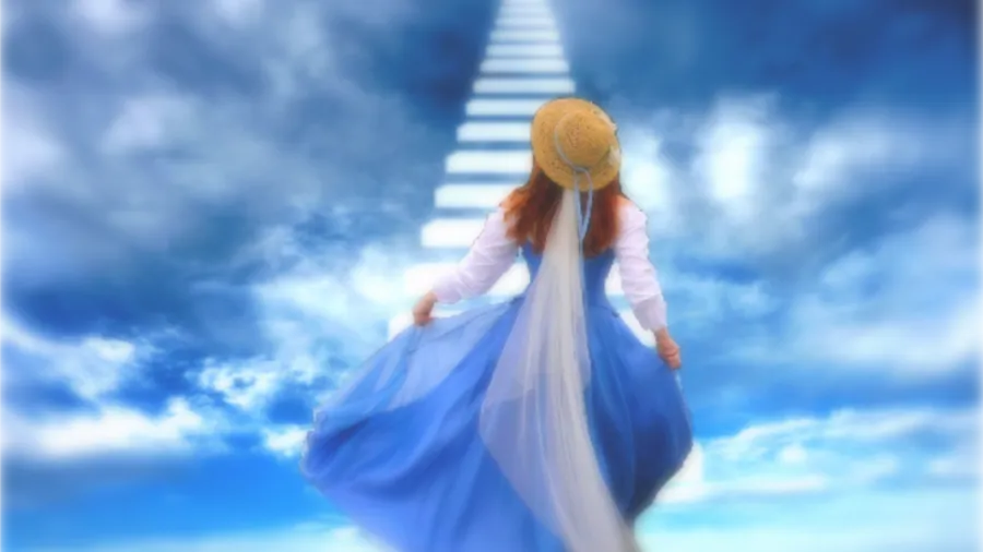 穿藍色連衣裙的女性爬發光樓梯上天空