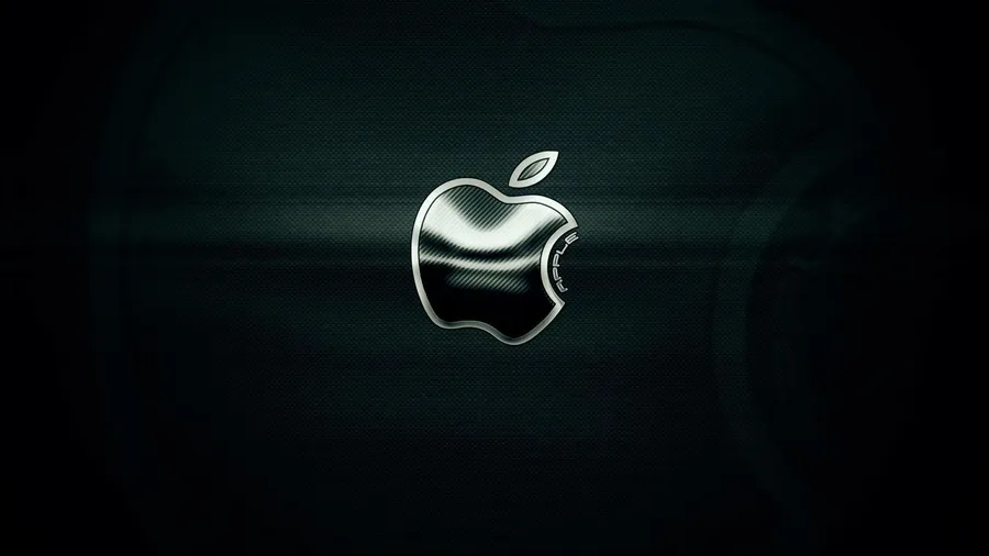 在深色背景上帶有碳纖維紋理的光亮 Apple 標誌