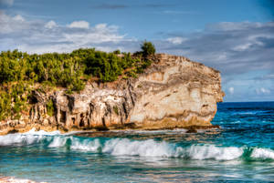 Rocky Cliff and Sandy Beach